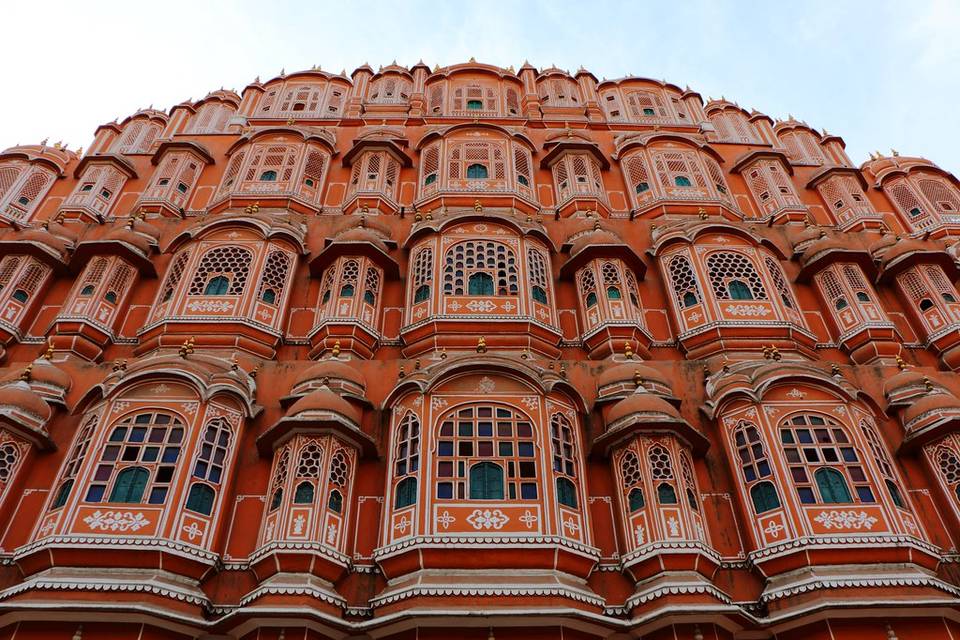 The carved pink sandstone facade of Hawa Mahal in Jaipur, Rajasthan